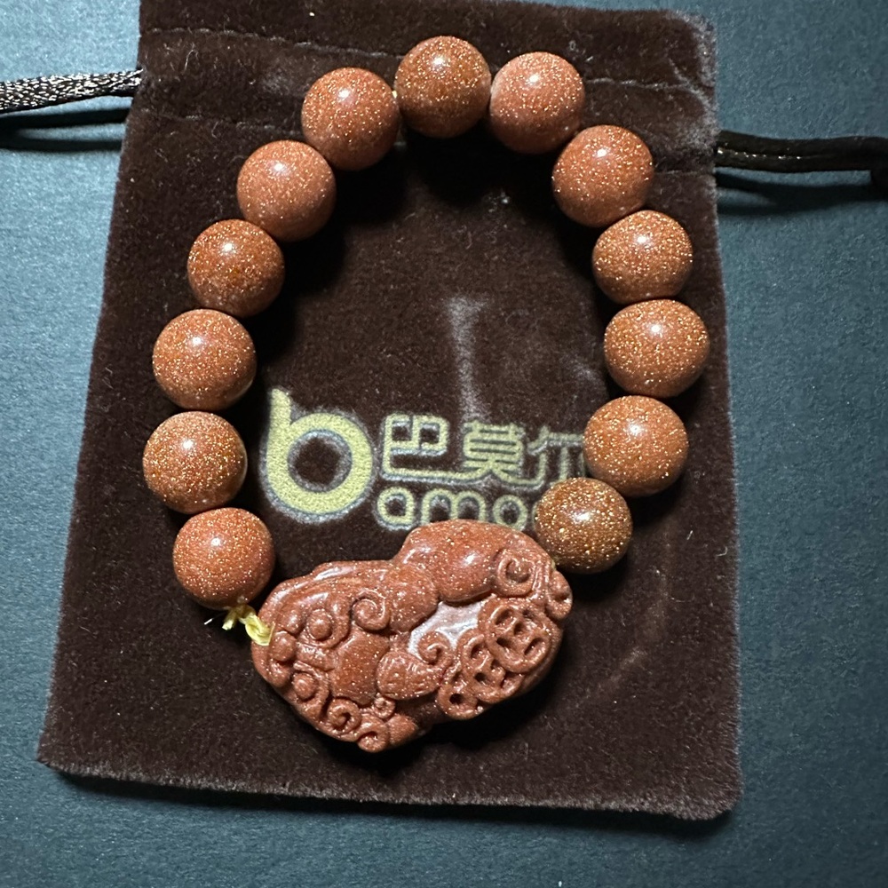 Brown Beaded Bracelet with Carved Pendant